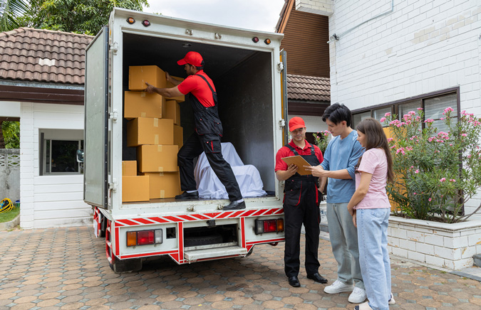 young-couple-accepting-package-from-deliverer