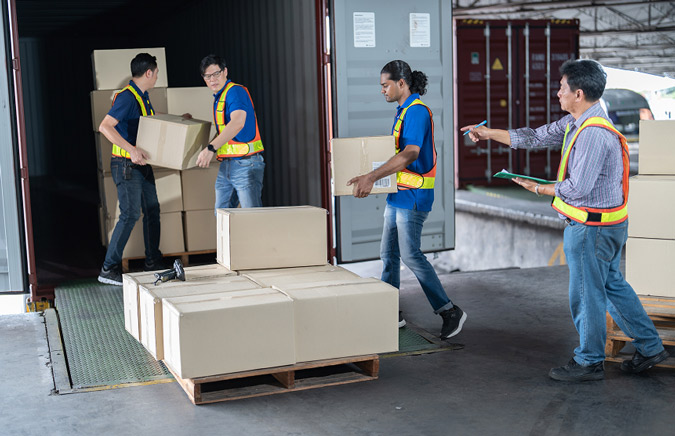 couriers-moving-boxes-in-to-truck