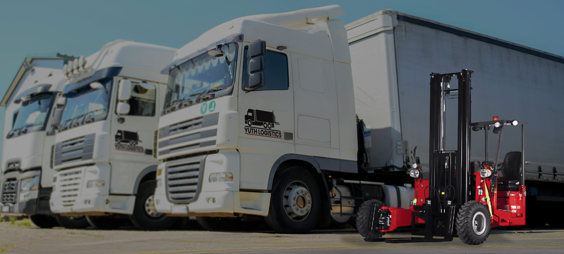 three-trucks-next-to-forklift